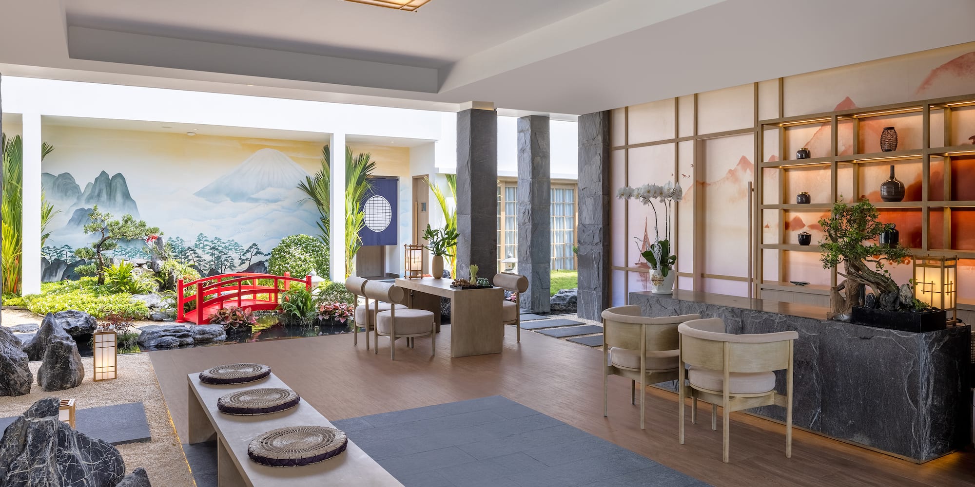 a room with a large window and a red bridge