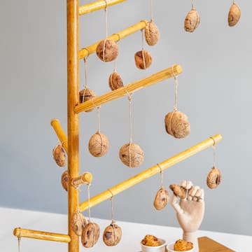 a wooden stand with cookies from it