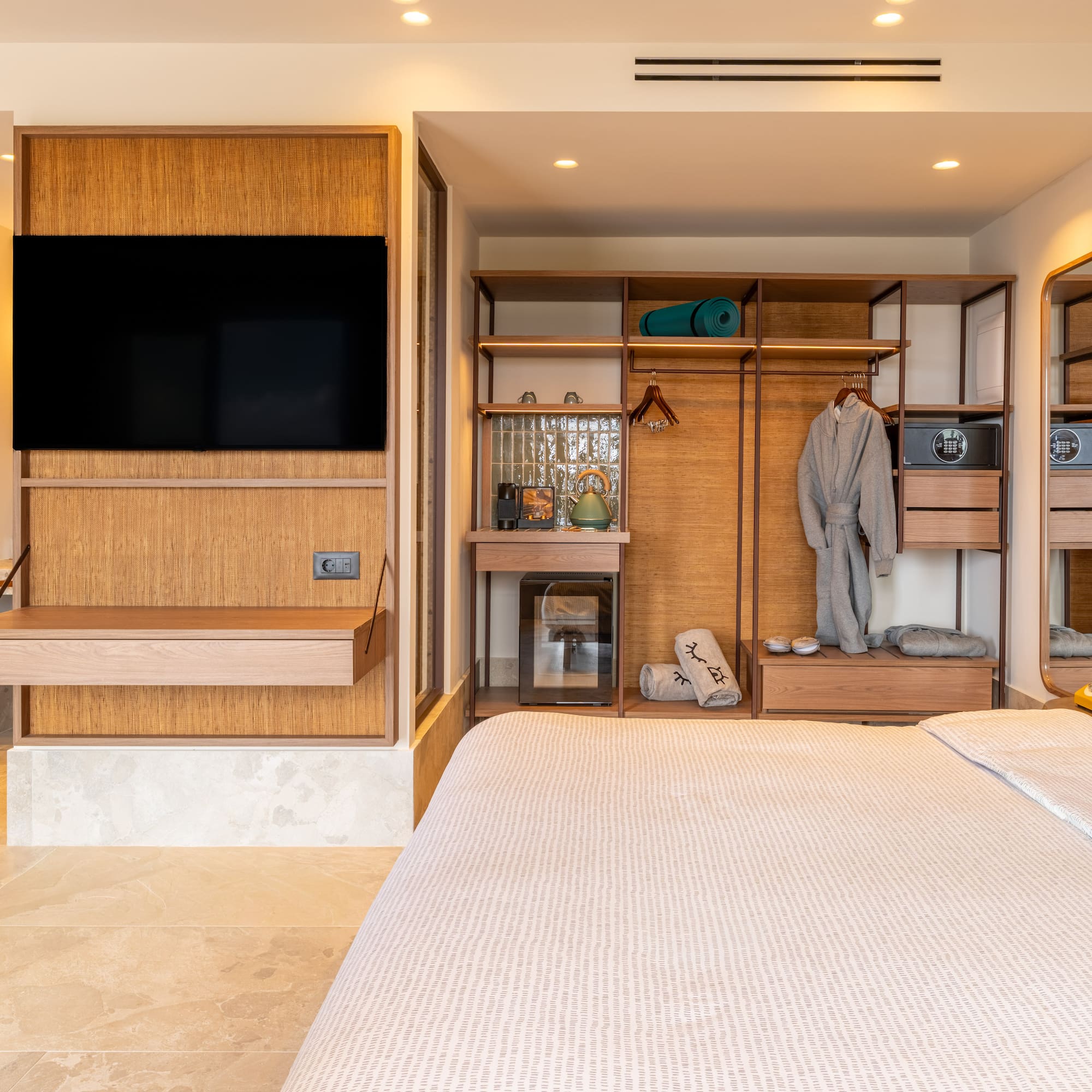a bedroom with a tv and a closet