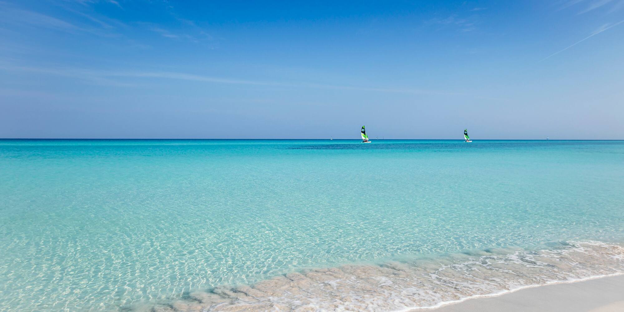 a person on a sailboat in the water