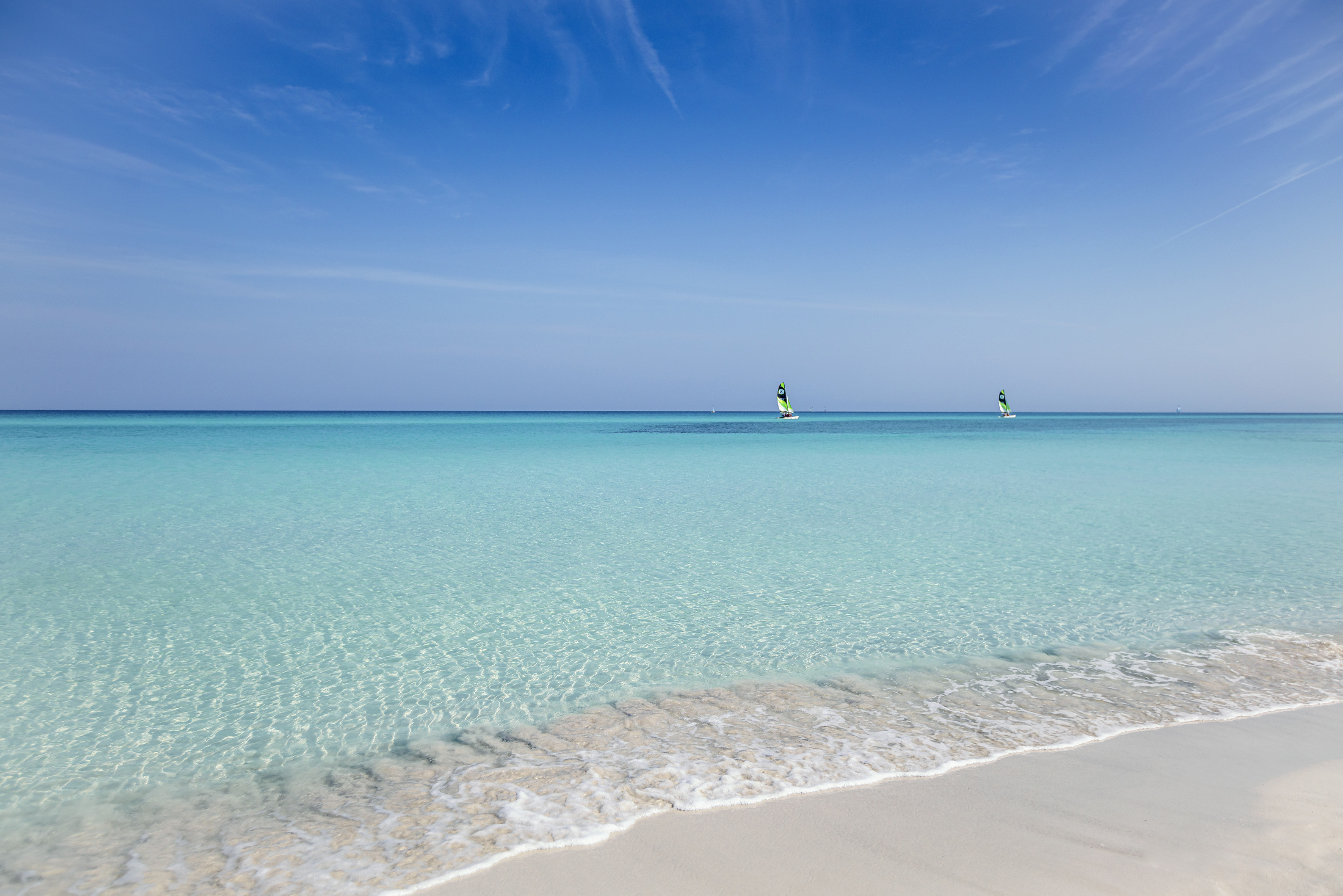 a person on a sailboat in the water
