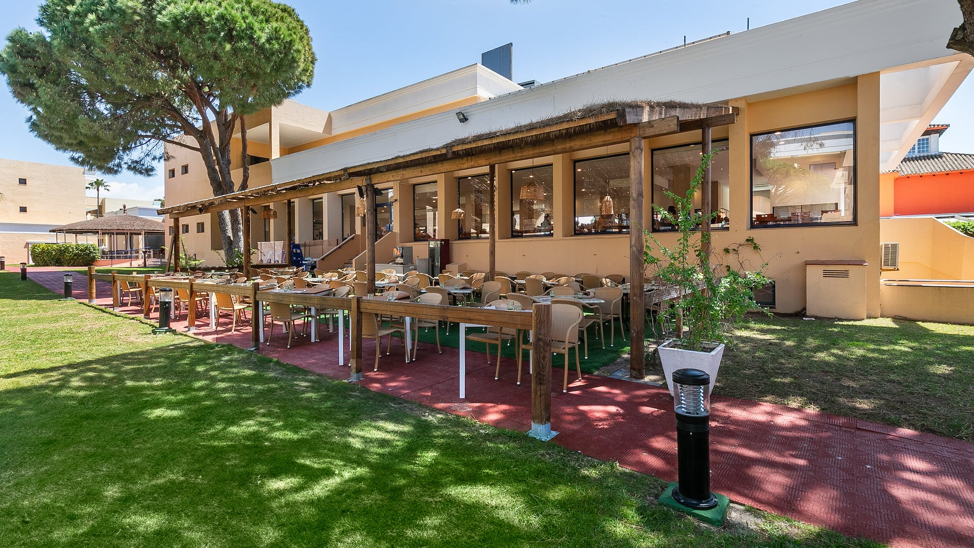 a building with tables and chairs outside
