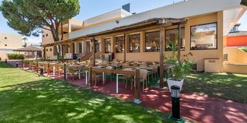 a building with tables and chairs outside