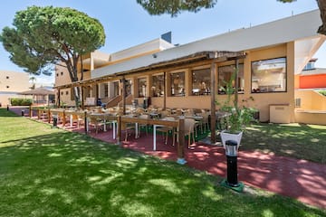 a building with tables and chairs outside