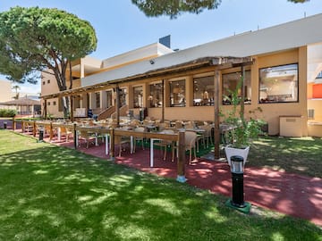 a building with tables and chairs outside