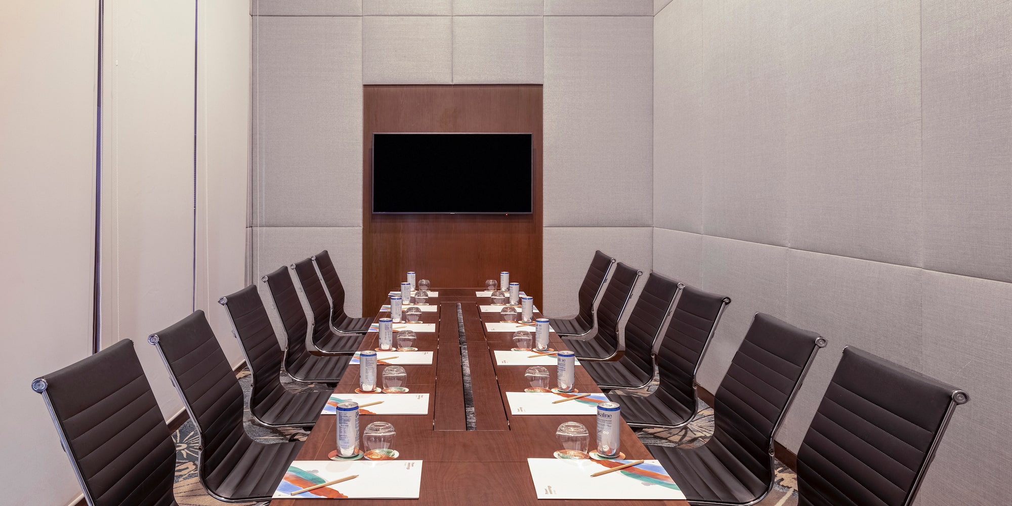 a conference room with a table and chairs