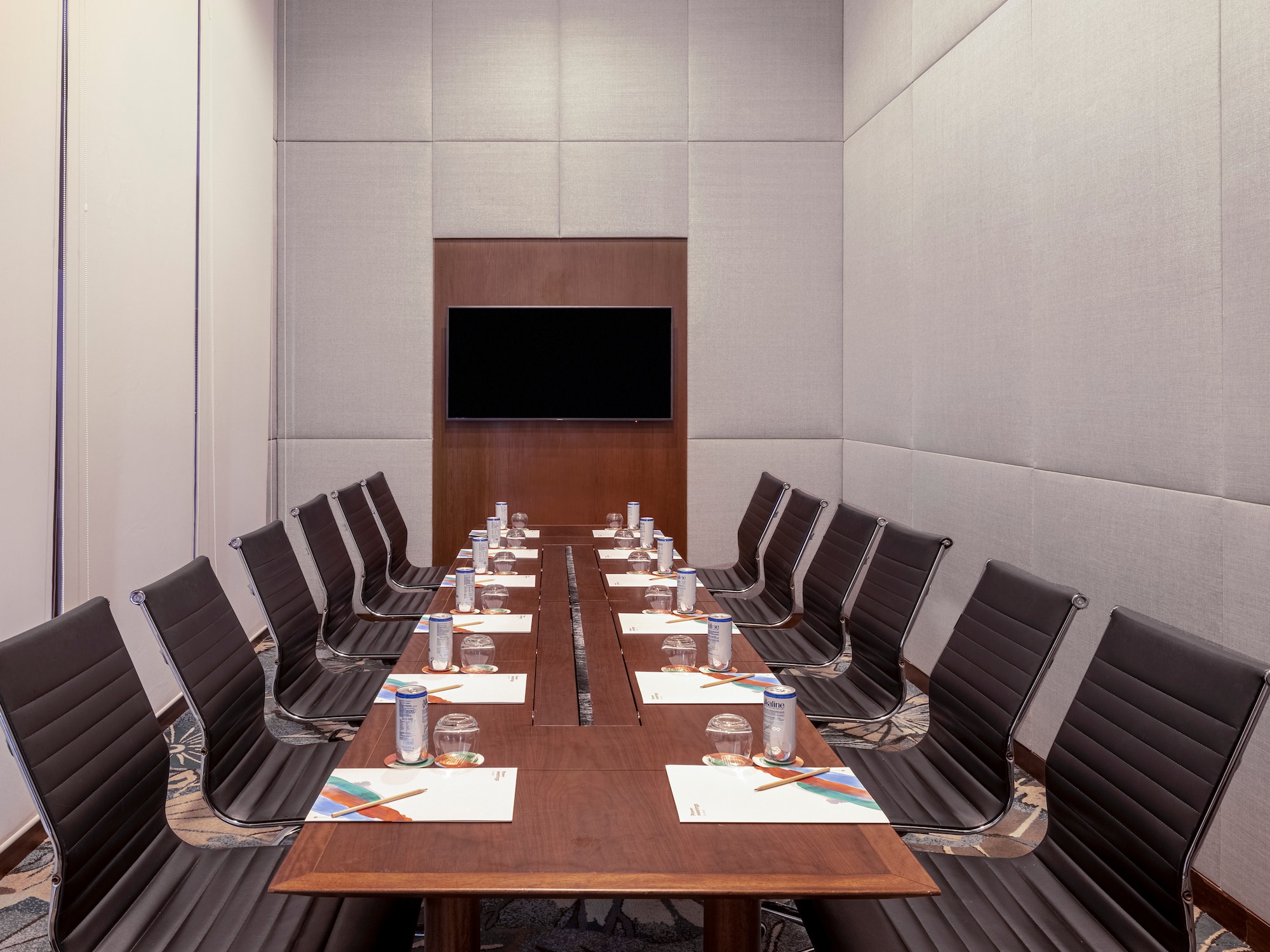 a conference room with a table and chairs
