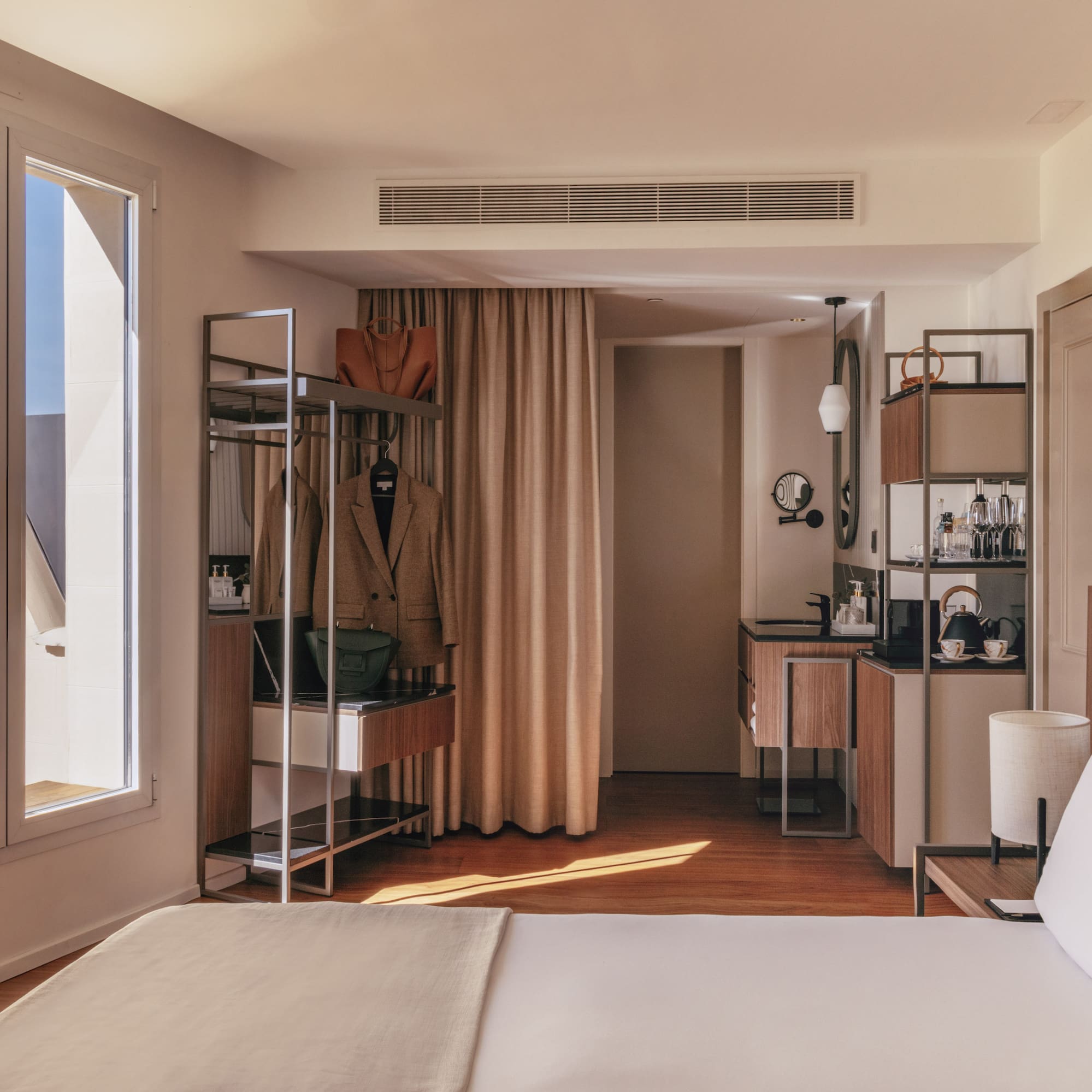 a room with a bed and a mirror