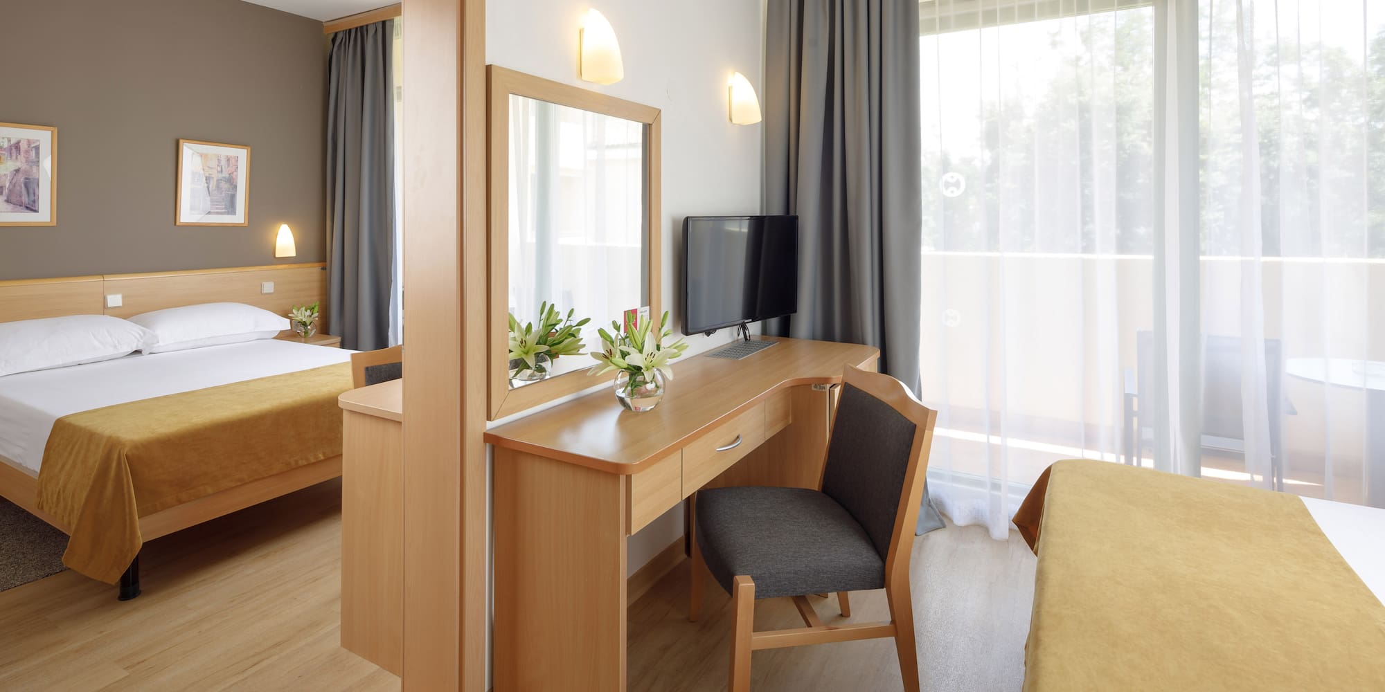 a room with a desk and a mirror