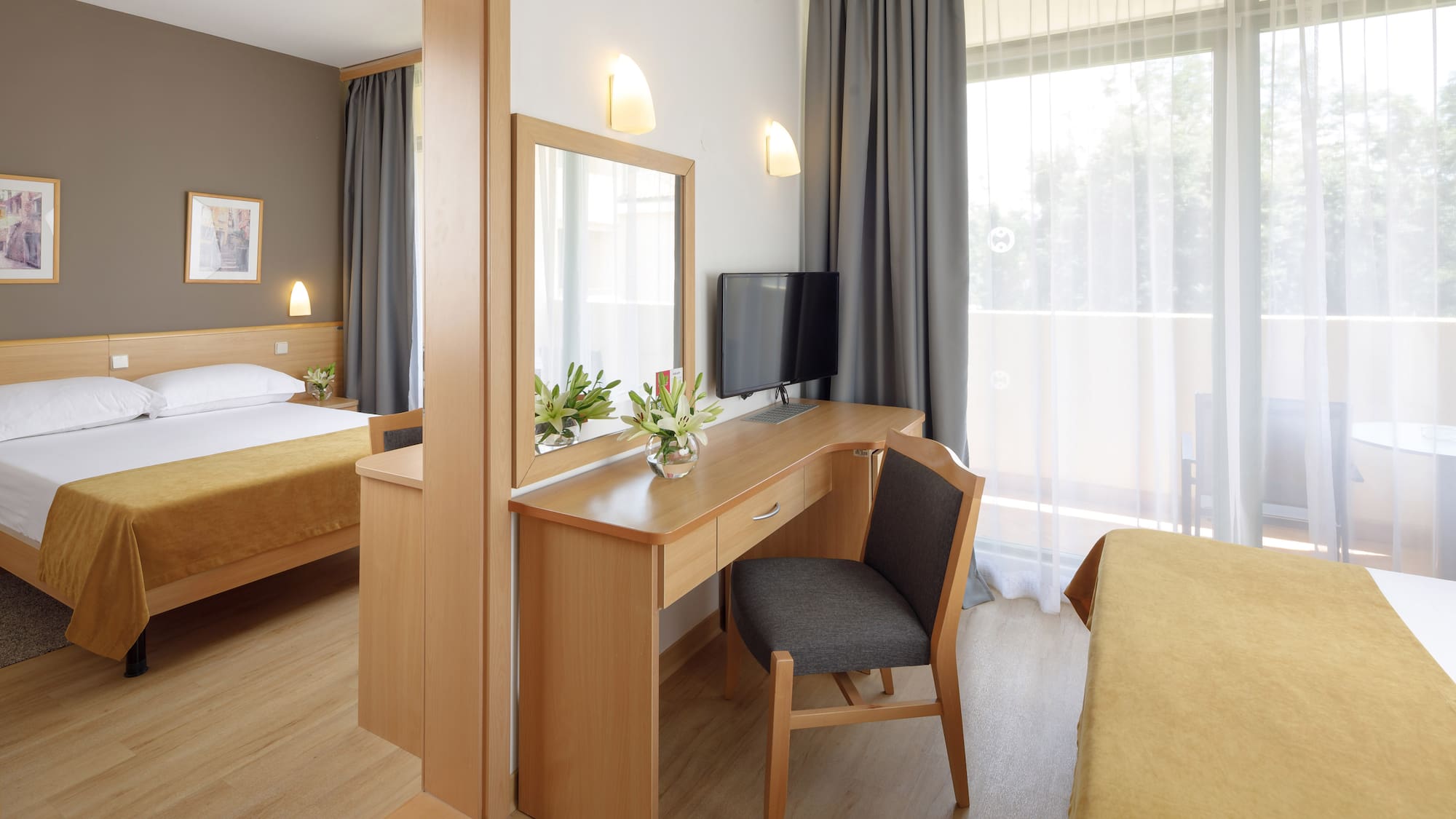 a room with a desk and a mirror