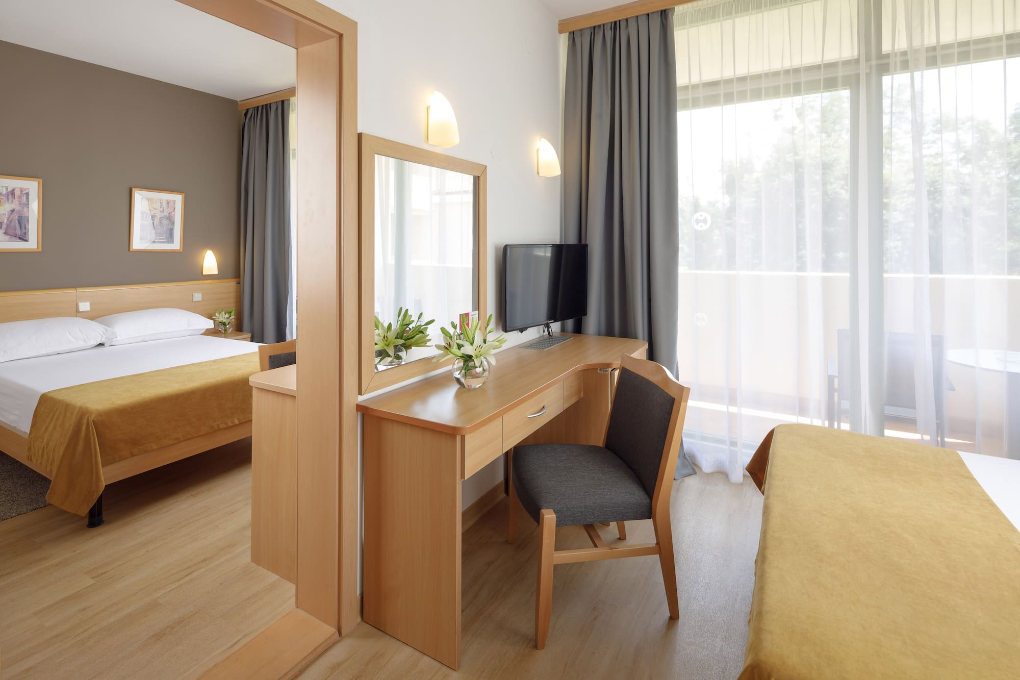 a room with a desk and a mirror