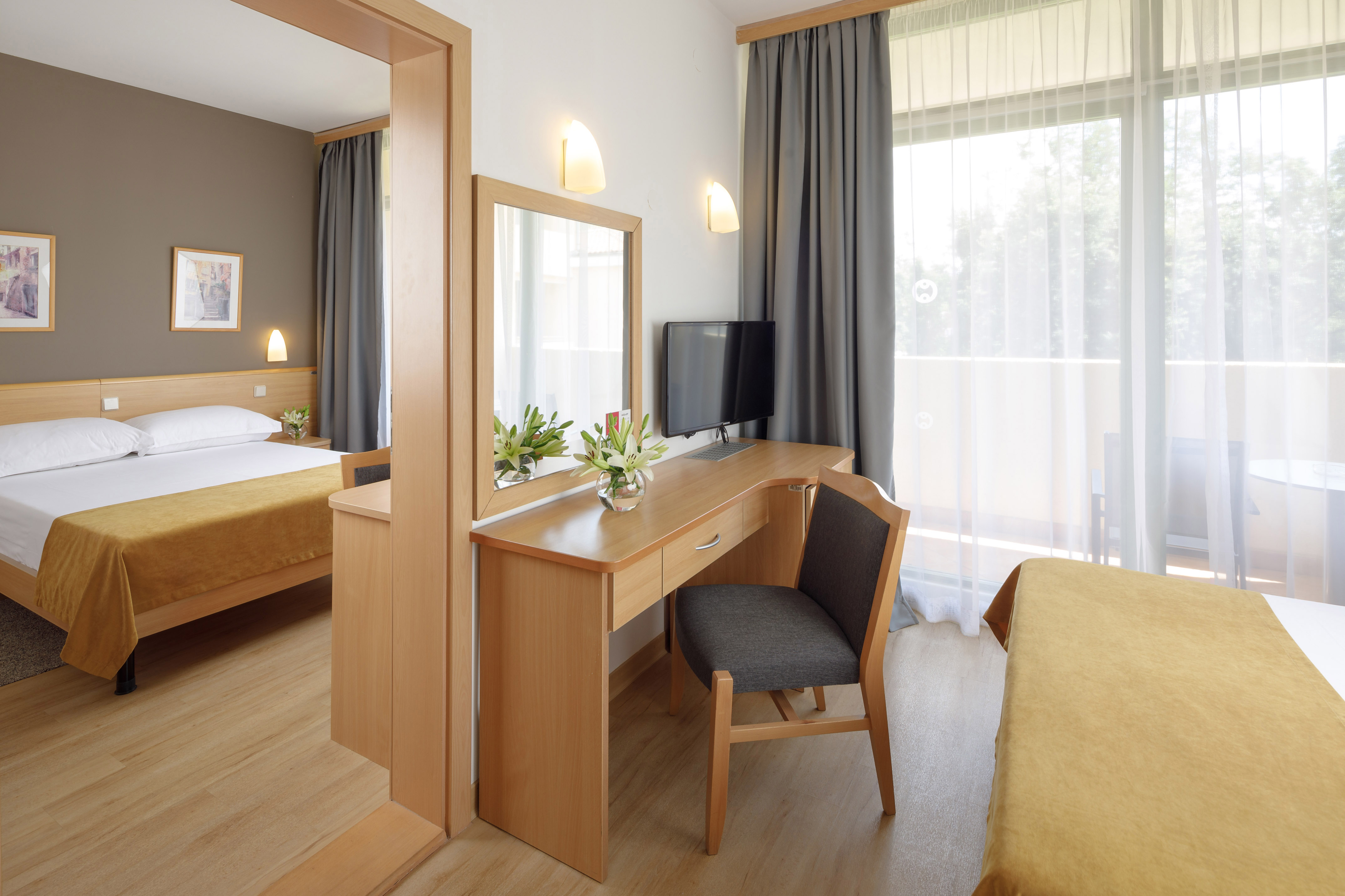 a room with a desk and a mirror