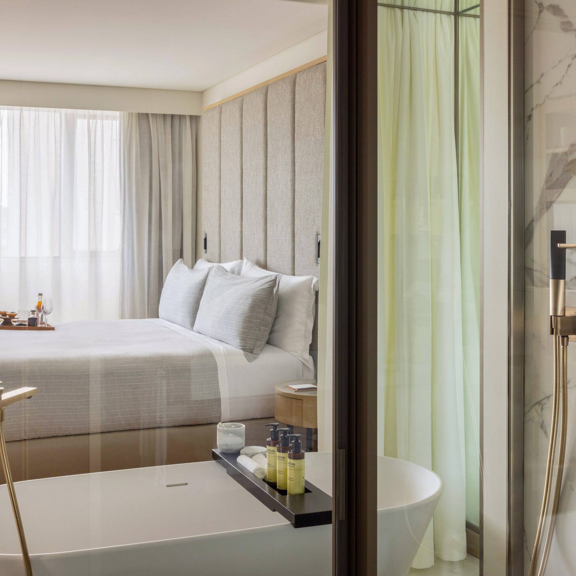 a bathroom with a bed and bathtub