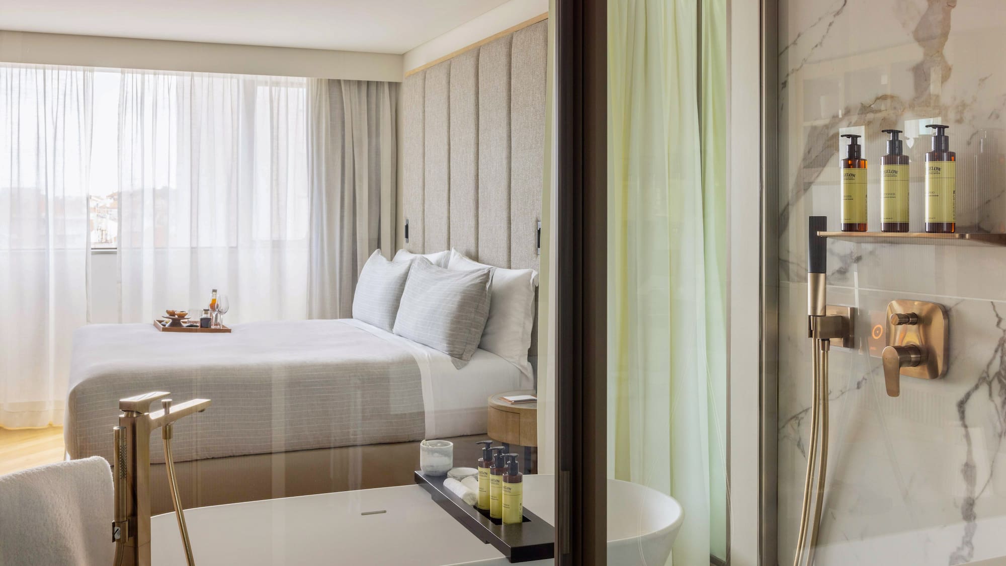 a bathroom with a bed and bathtub