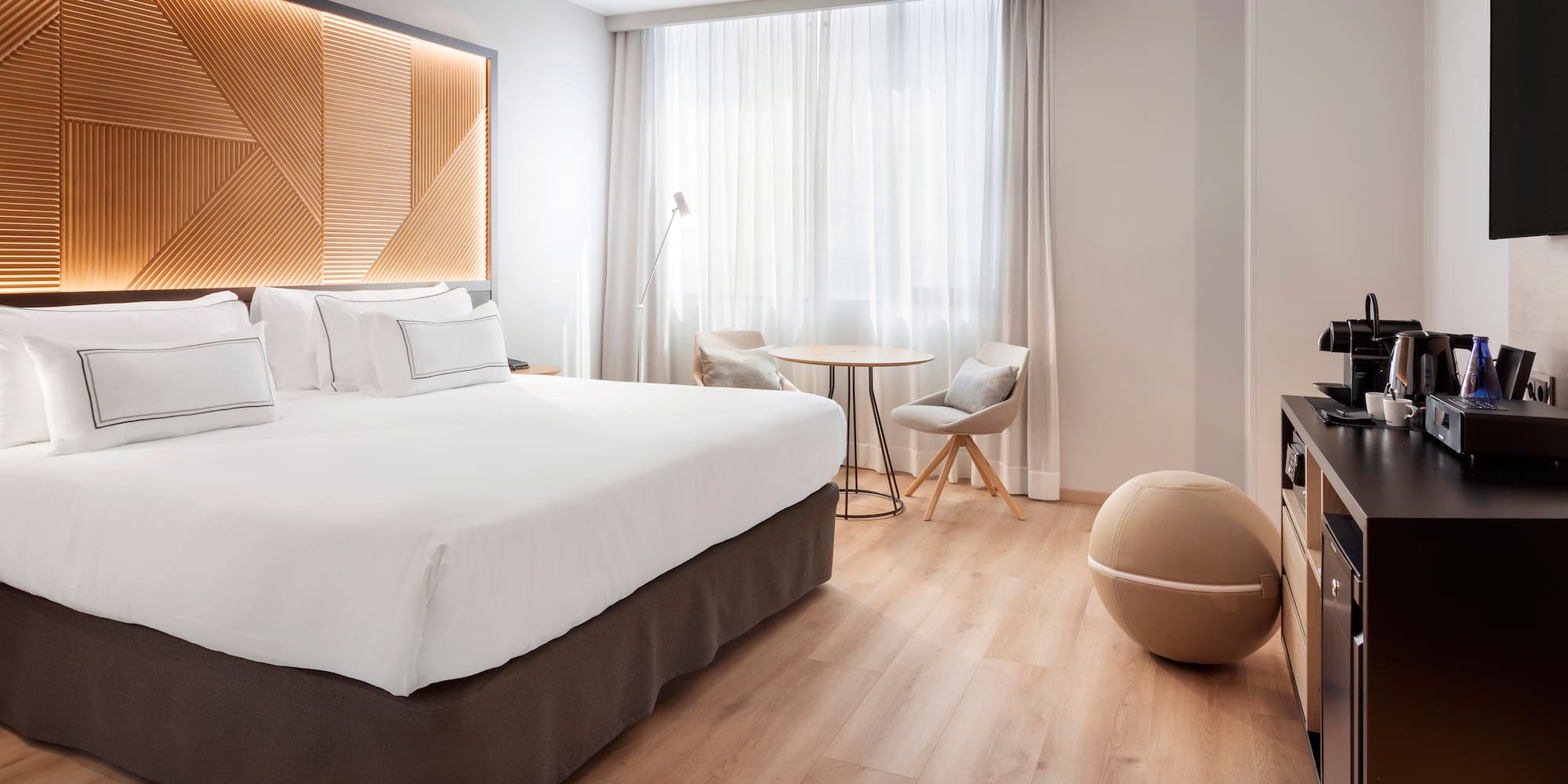 a room with a bed and a television