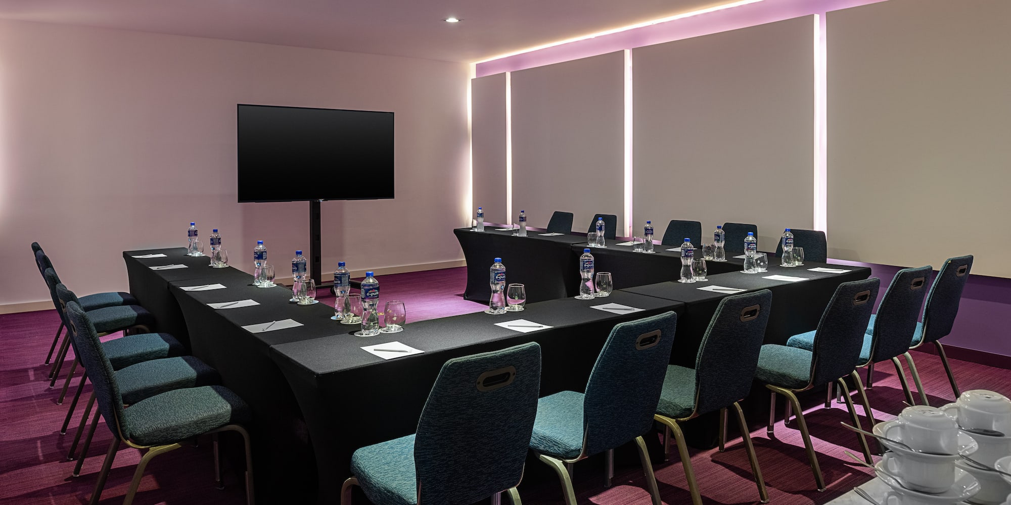 a room with a table and chairs