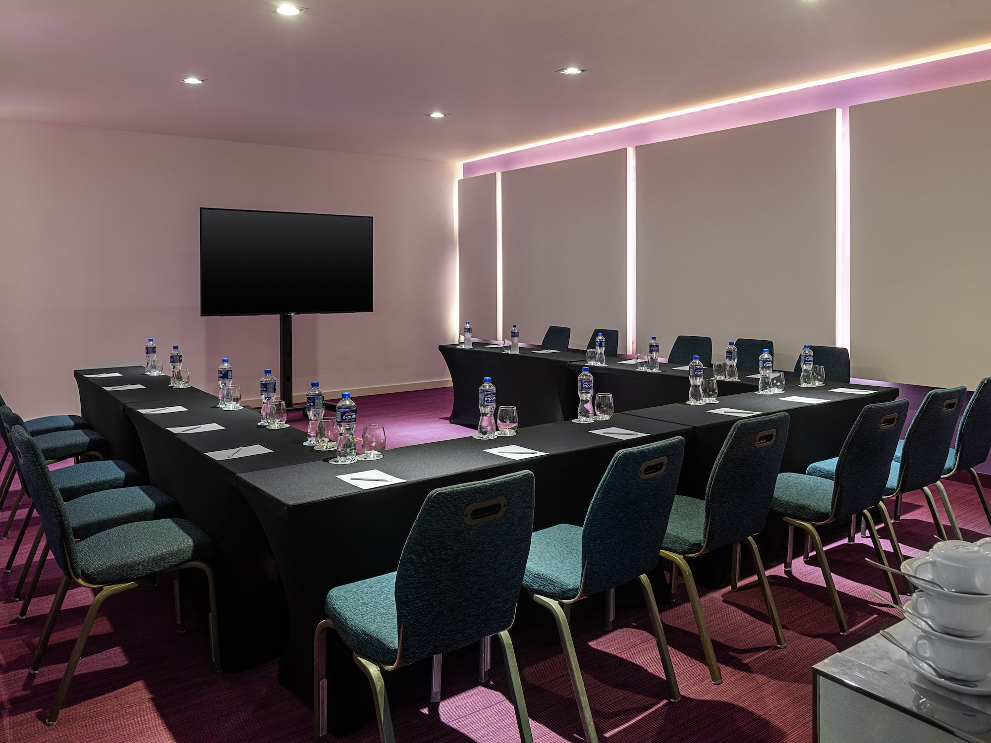 a room with a table and chairs