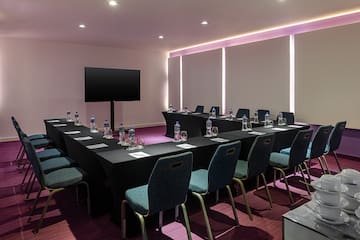 a room with a table and chairs