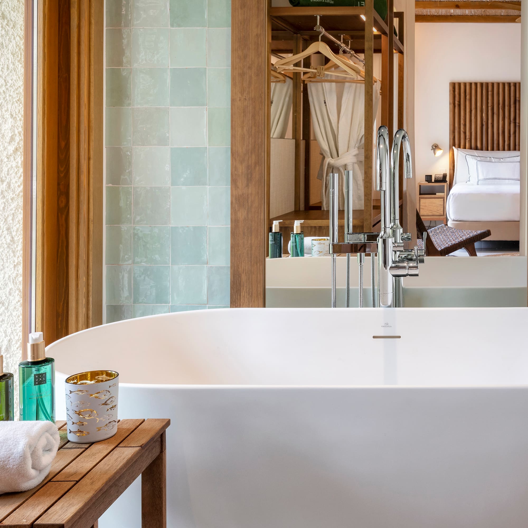 a bathroom with a bathtub and a mirror