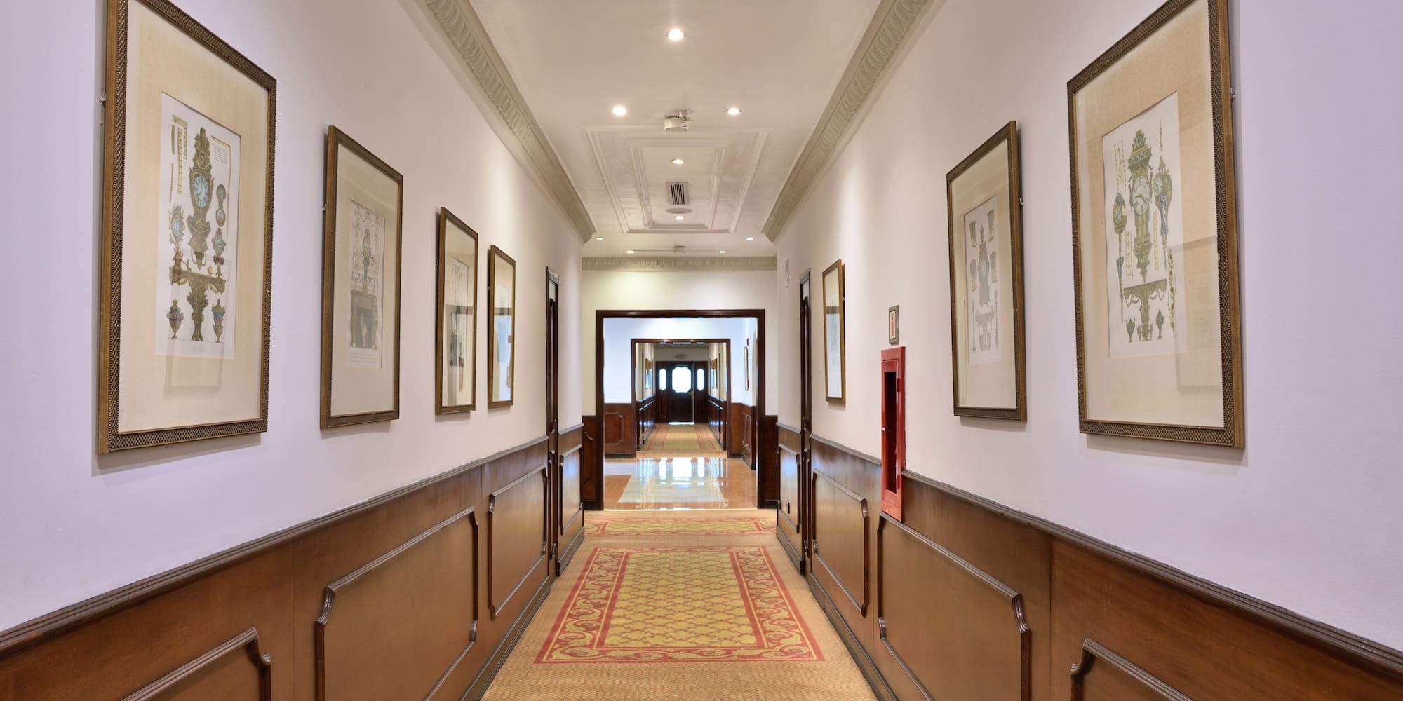 a hallway with pictures on the wall