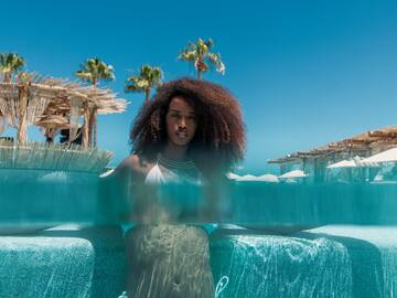 a woman in a garment in a pool