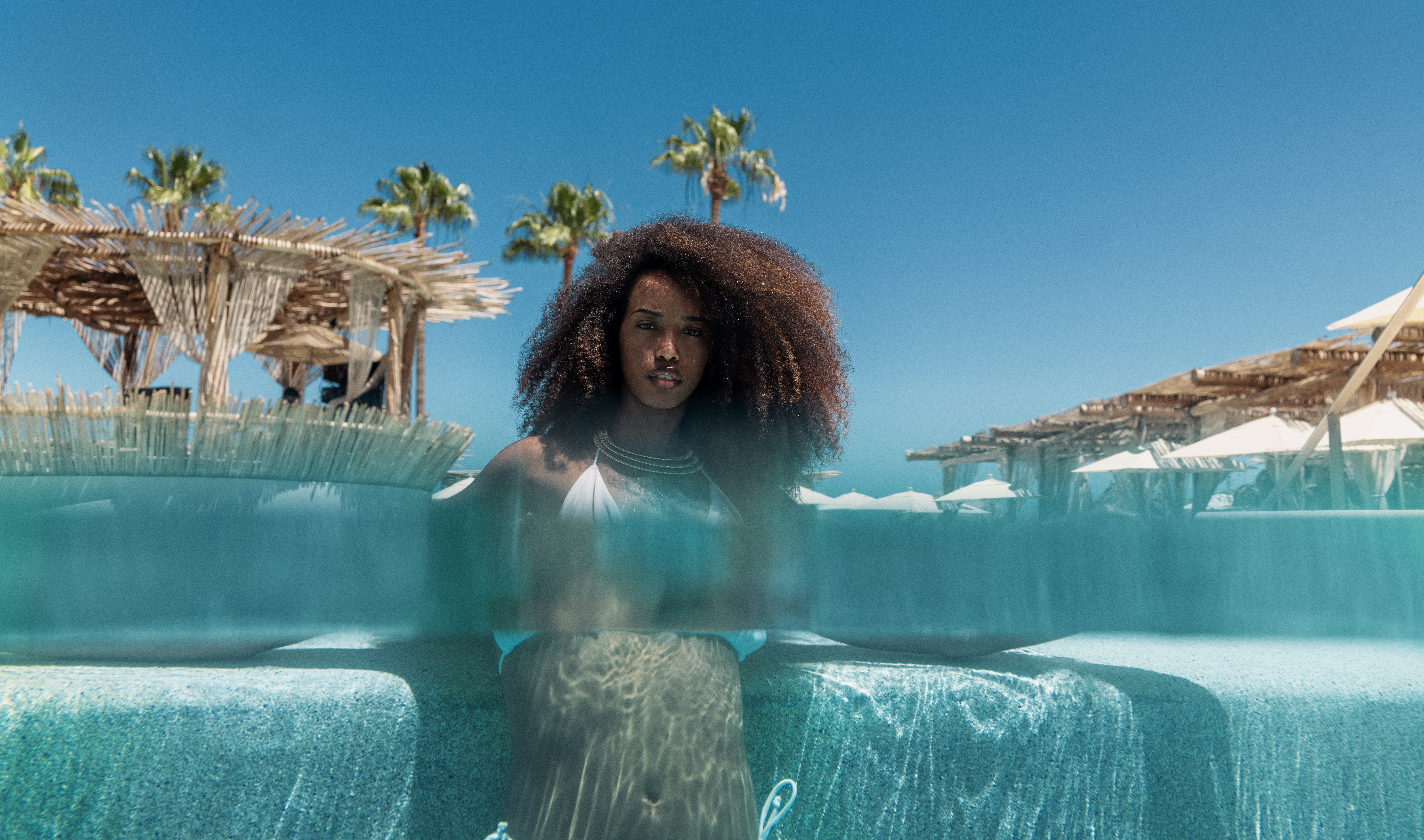 a woman in a garment in a pool