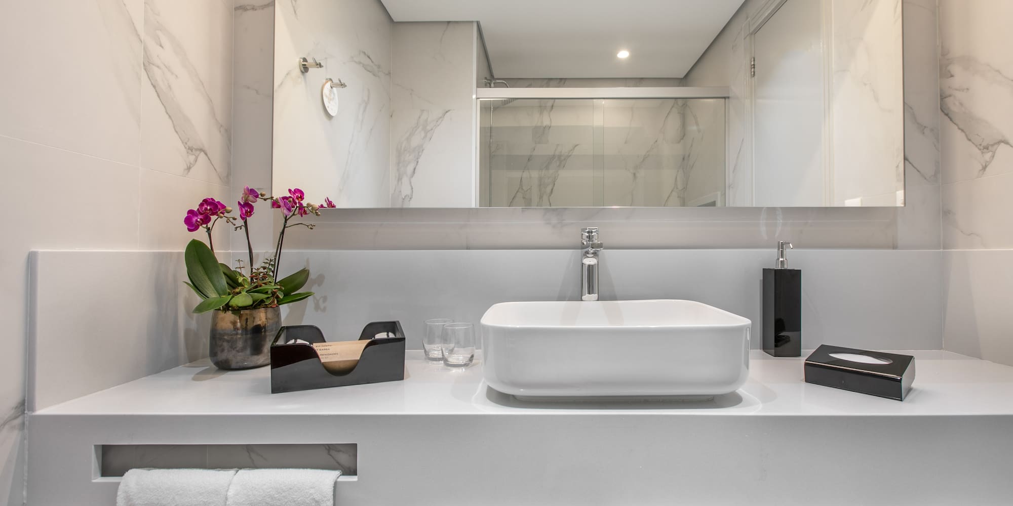 a bathroom with a sink and a mirror