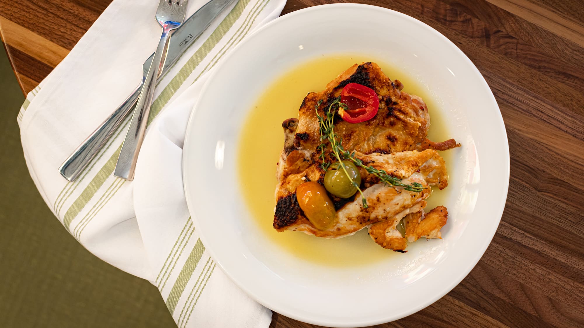 a plate of food on a napkin and a napkin