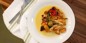 a plate of food on a napkin and a napkin