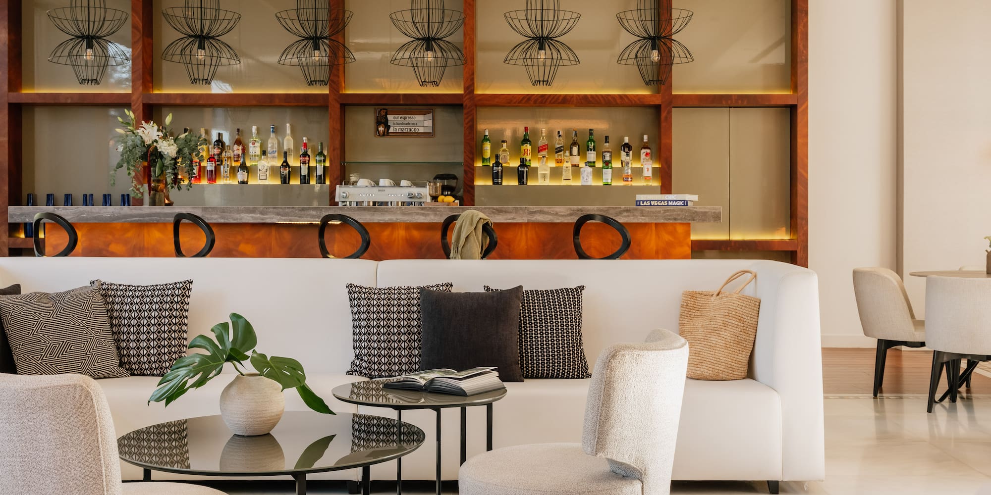 a room with a bar and a couch and a table