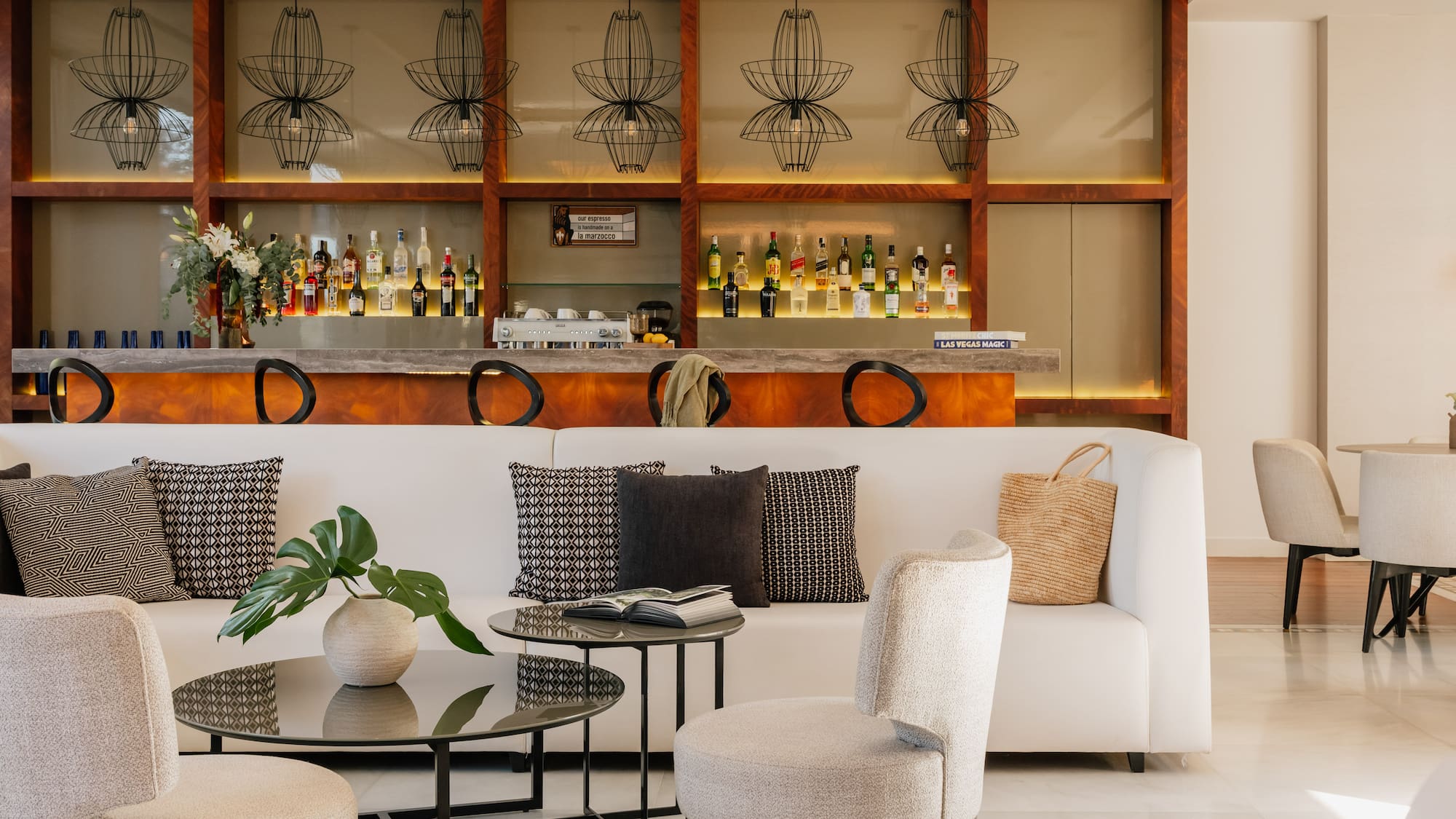 a room with a bar and a couch and a table