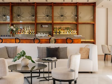 a room with a bar and a couch and a table