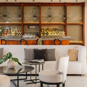 a room with a bar and a couch and a table