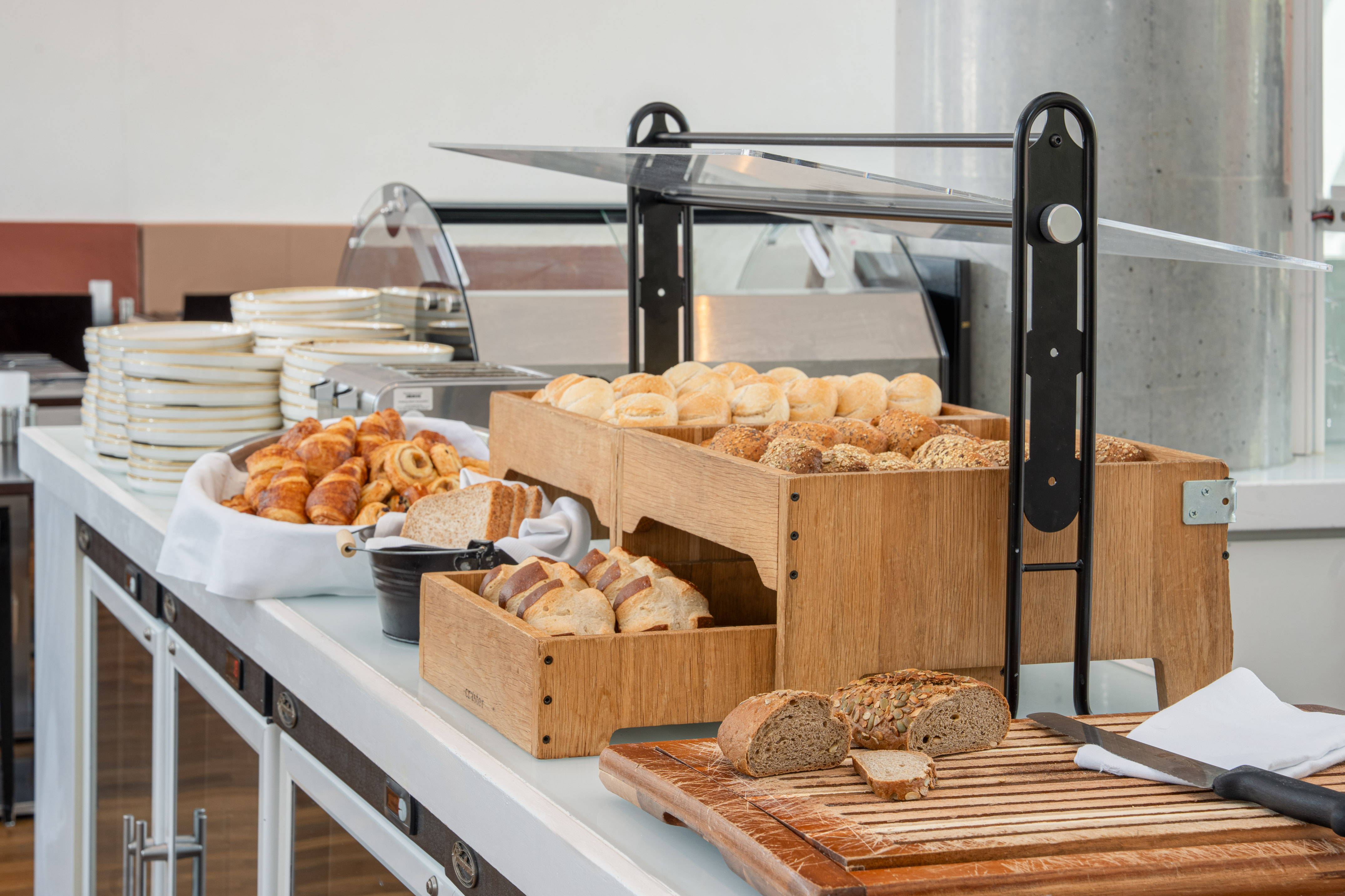 a buffet table with bread and rolls