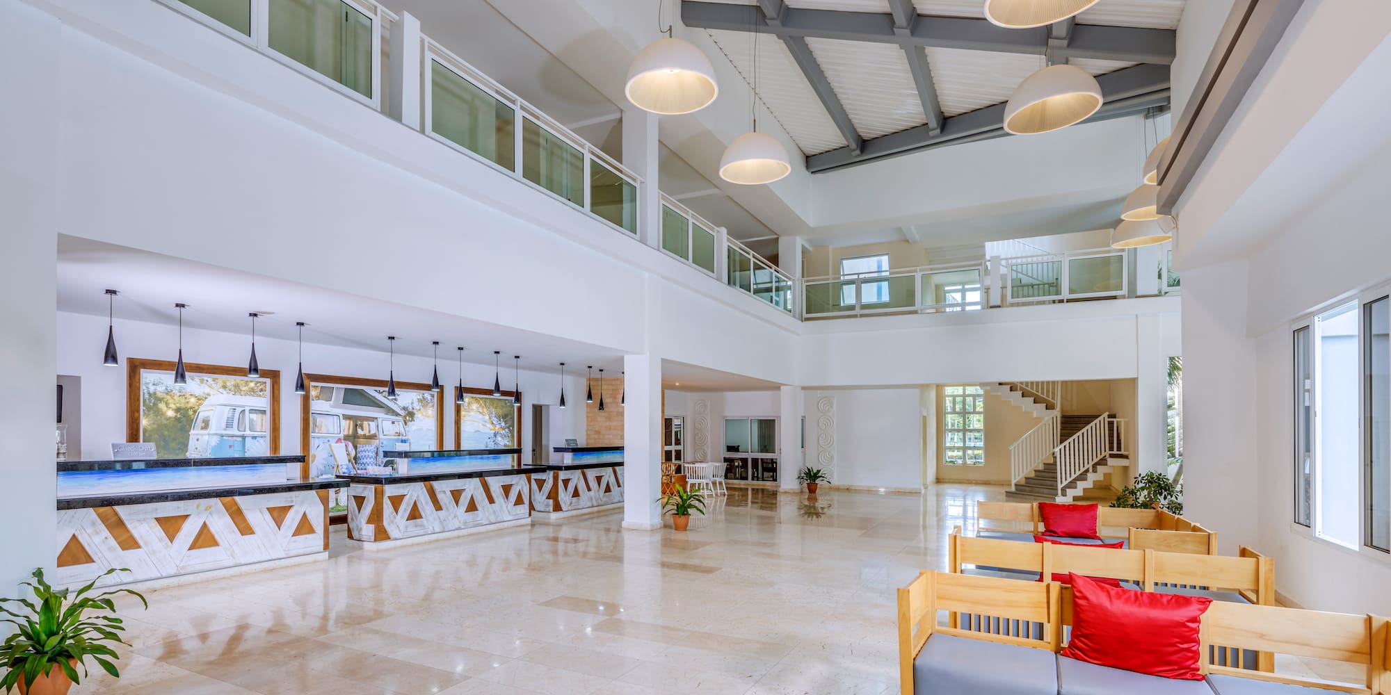 a large room with a large counter and chairs