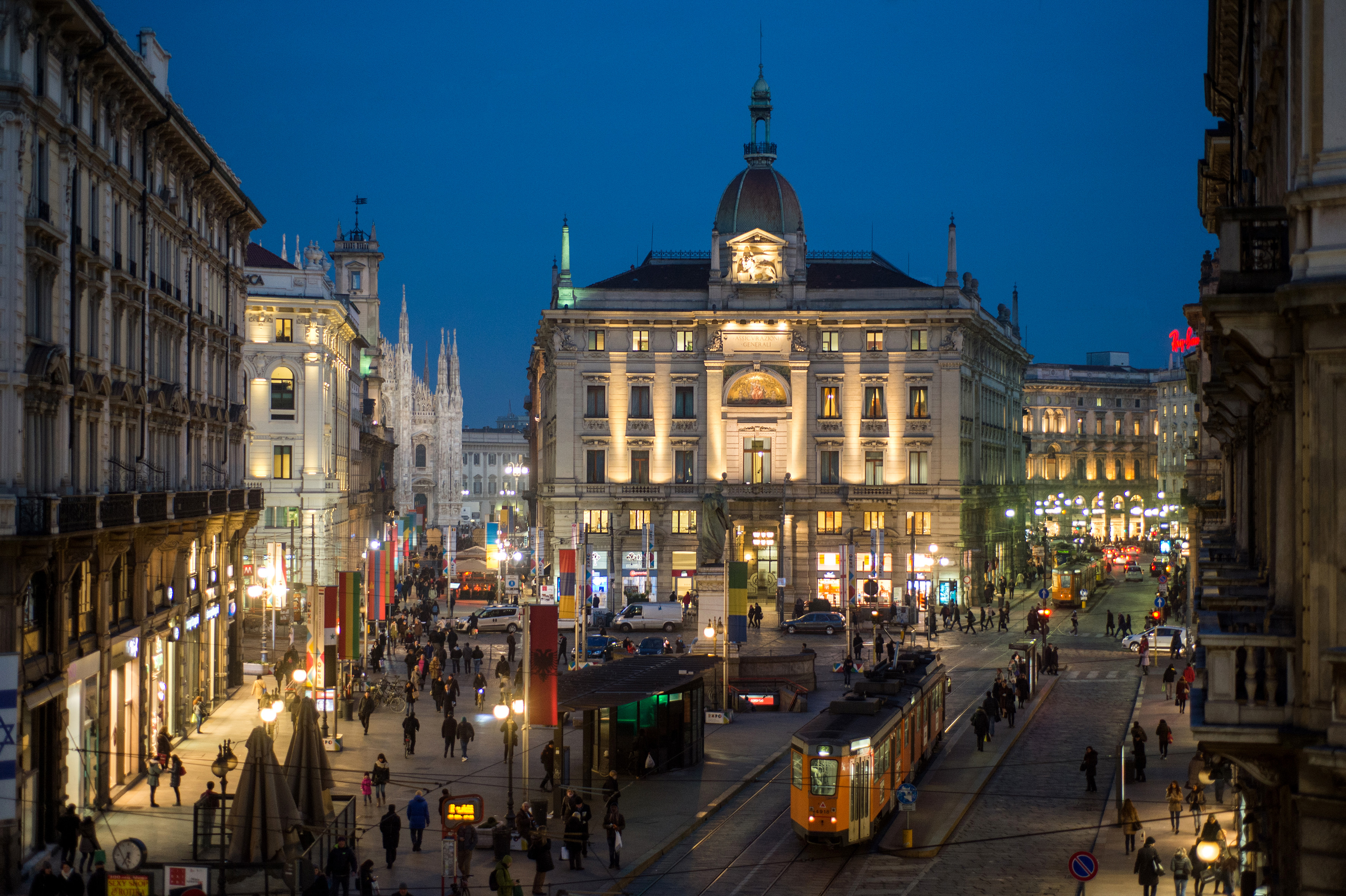 a city street with people and buildings