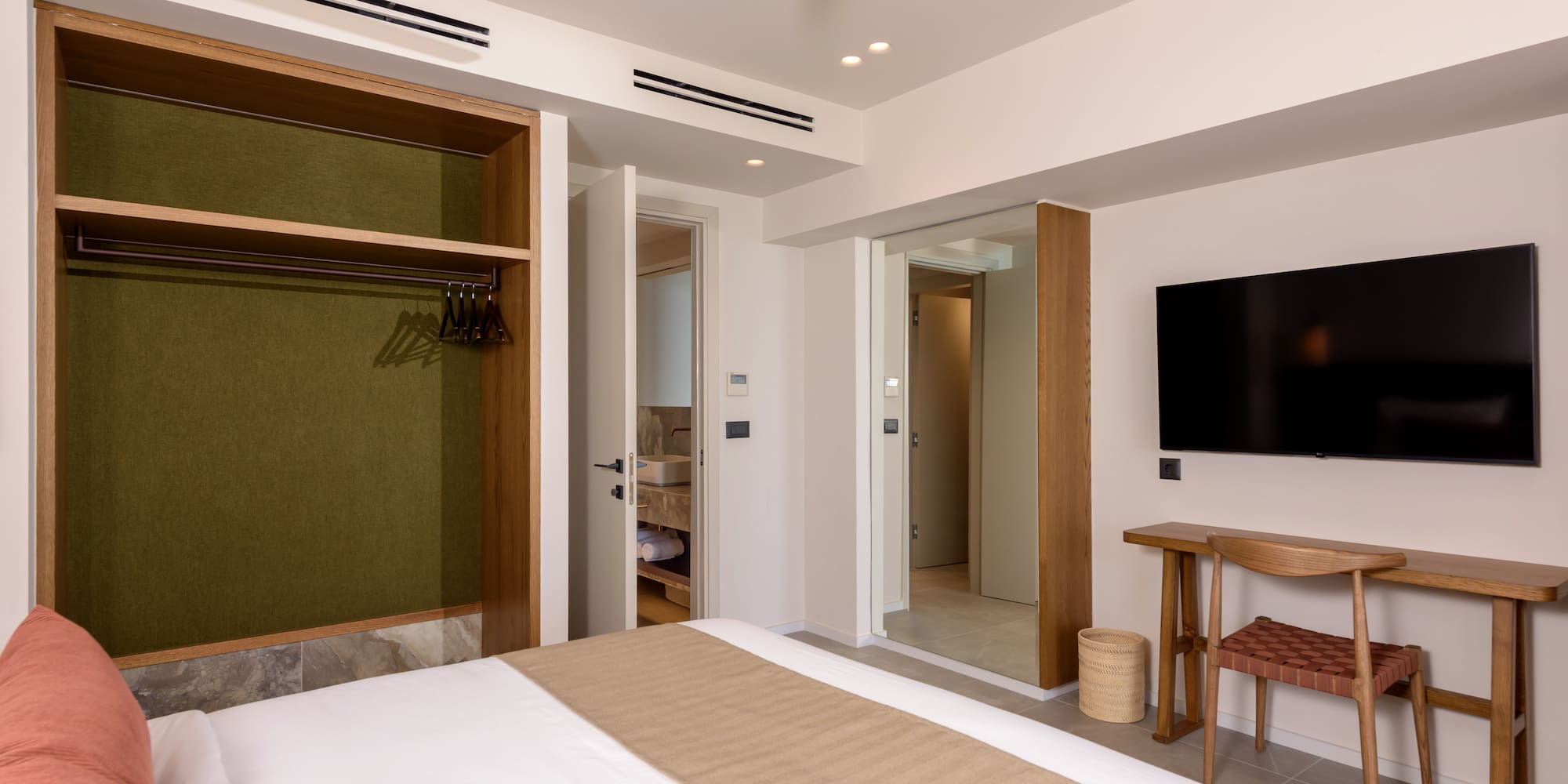 a room with a bed and a tv.