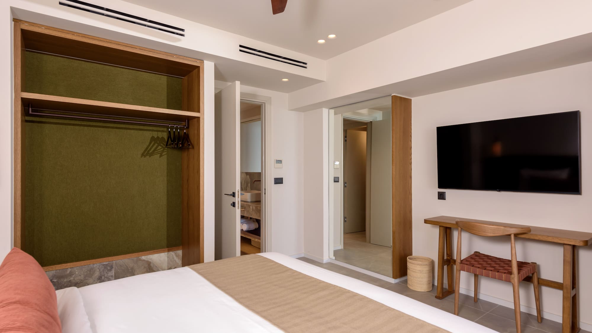 a room with a bed and a tv.