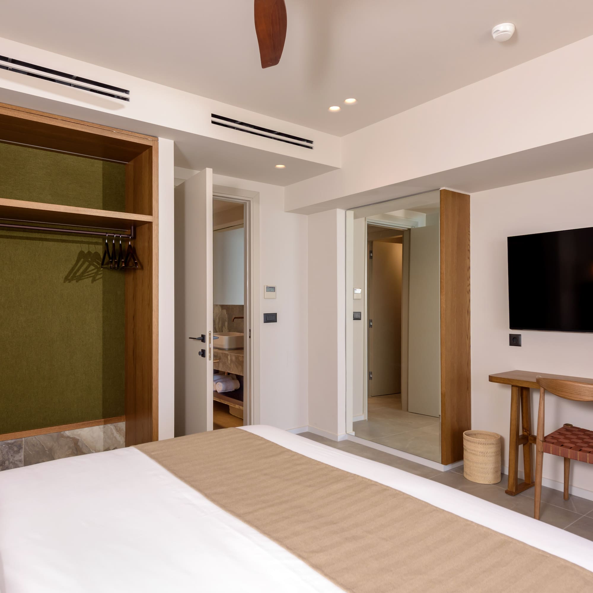 a room with a bed and a tv.