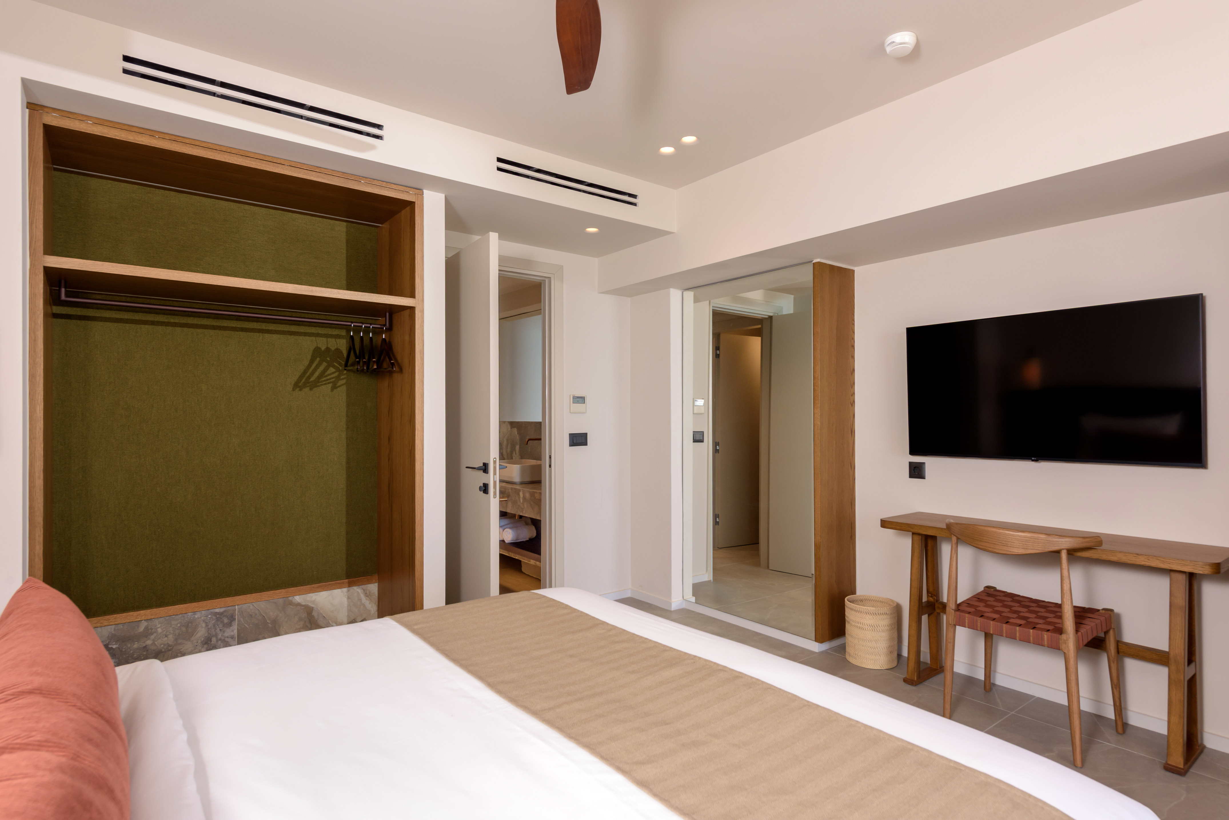 a room with a bed and a tv.