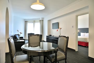 a room with a table and chairs