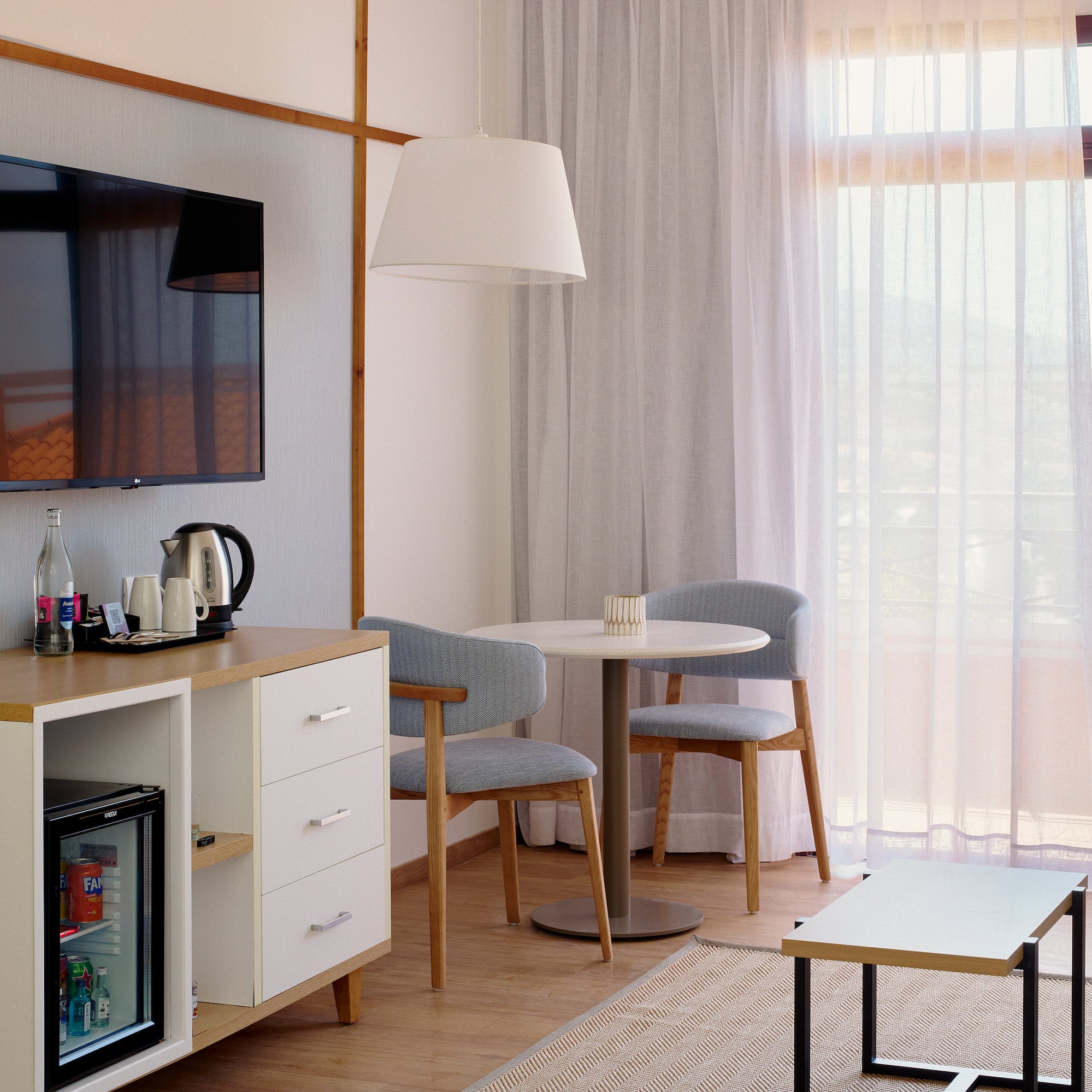 a room with a tv and a table