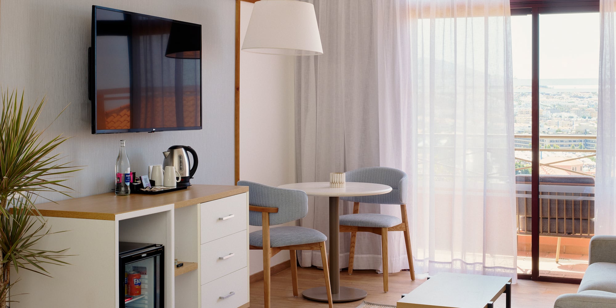 a room with a tv and a table