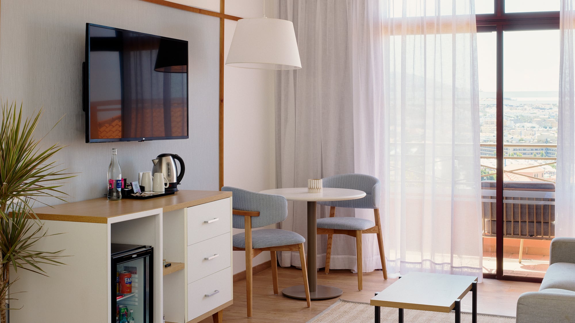 a room with a tv and a table