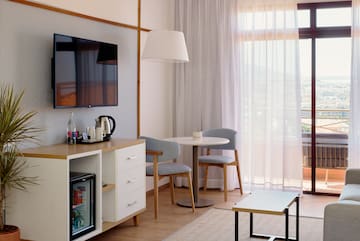 a room with a tv and a table