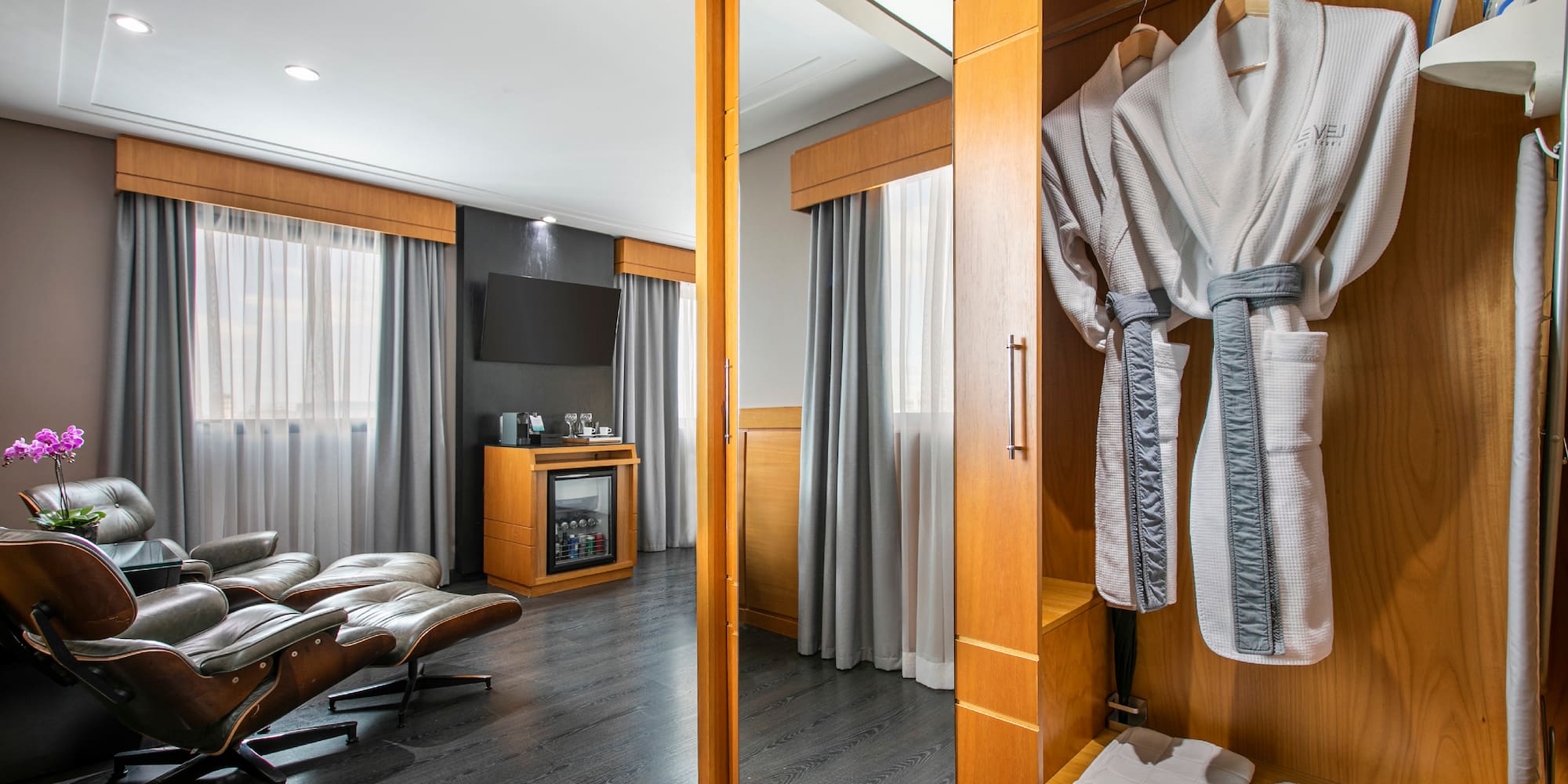 a room with a mirror and a robe from a swinger