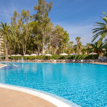 a pool with umbrellas and chairs