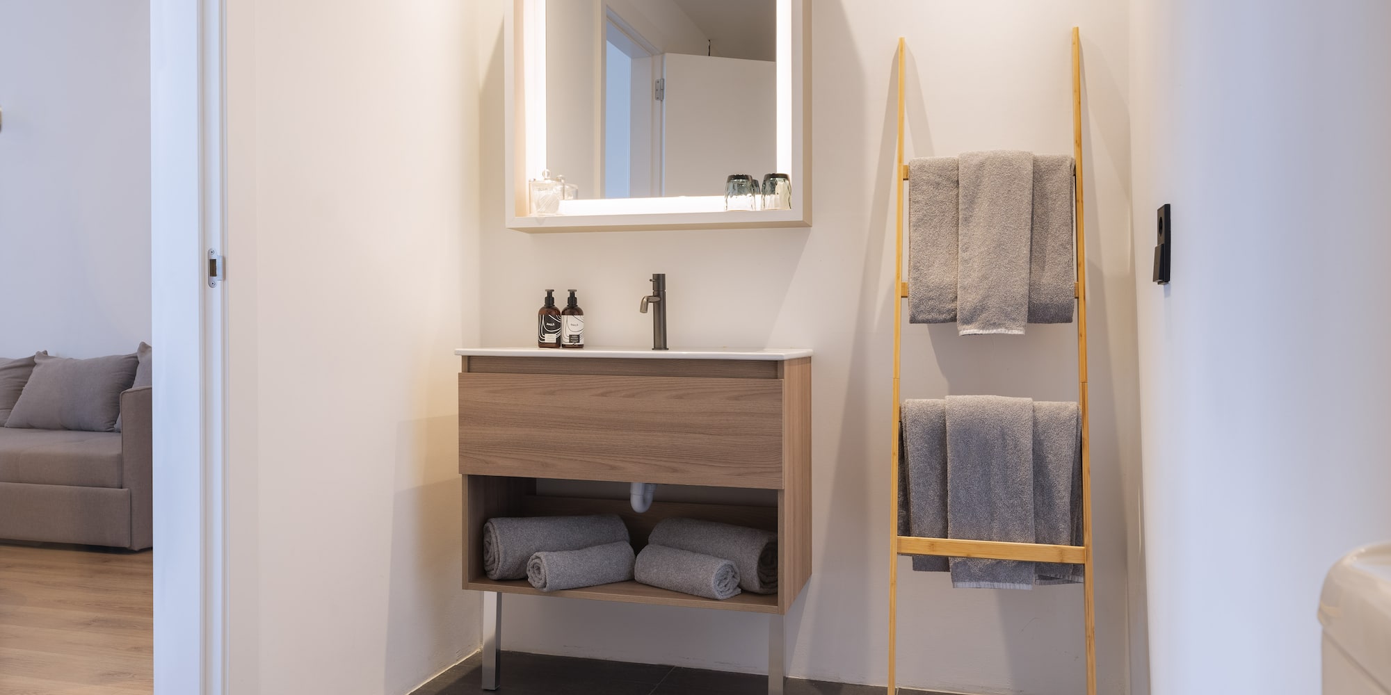 a bathroom with a mirror and sink