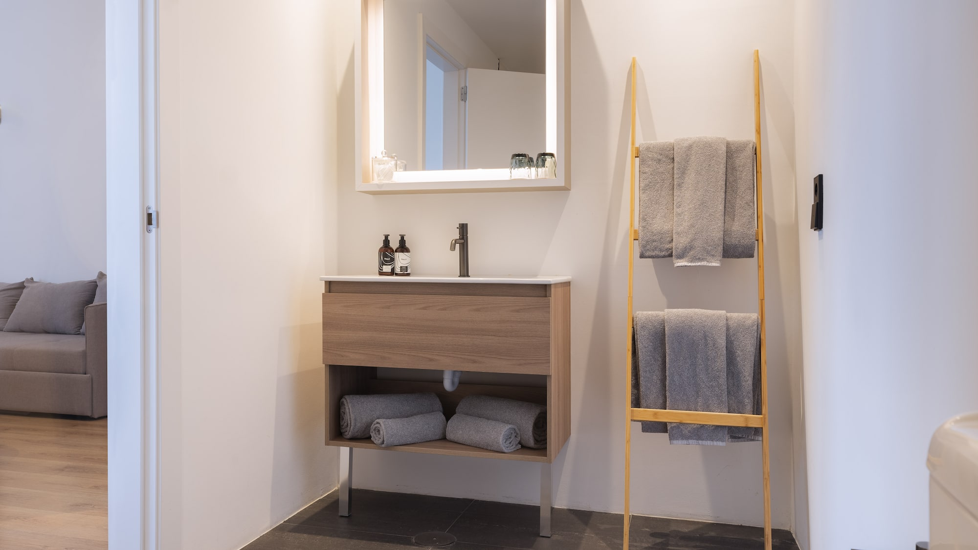 a bathroom with a mirror and sink