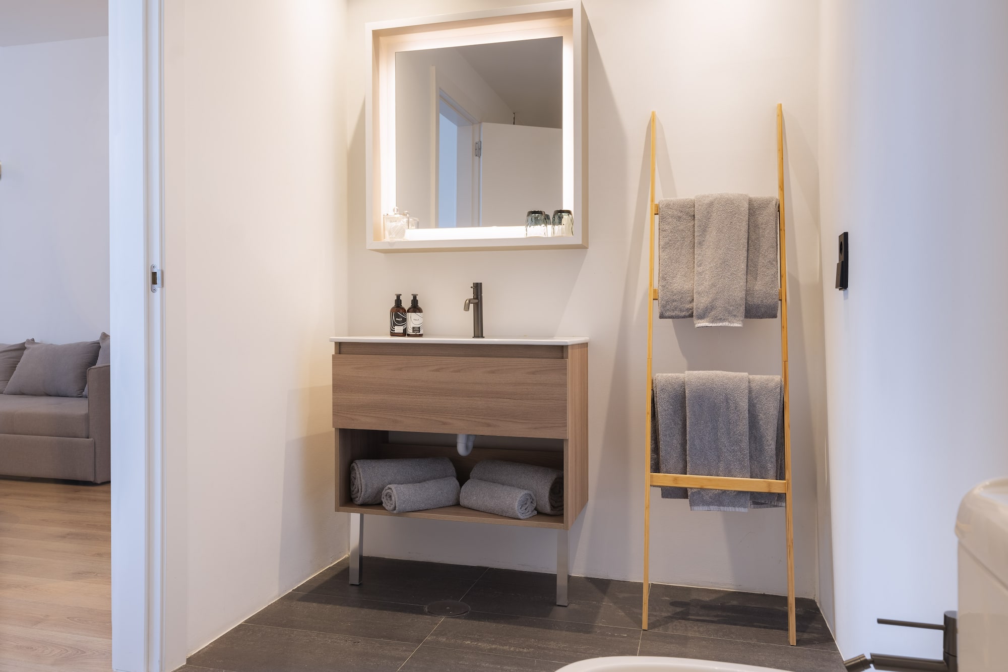 a bathroom with a mirror and sink